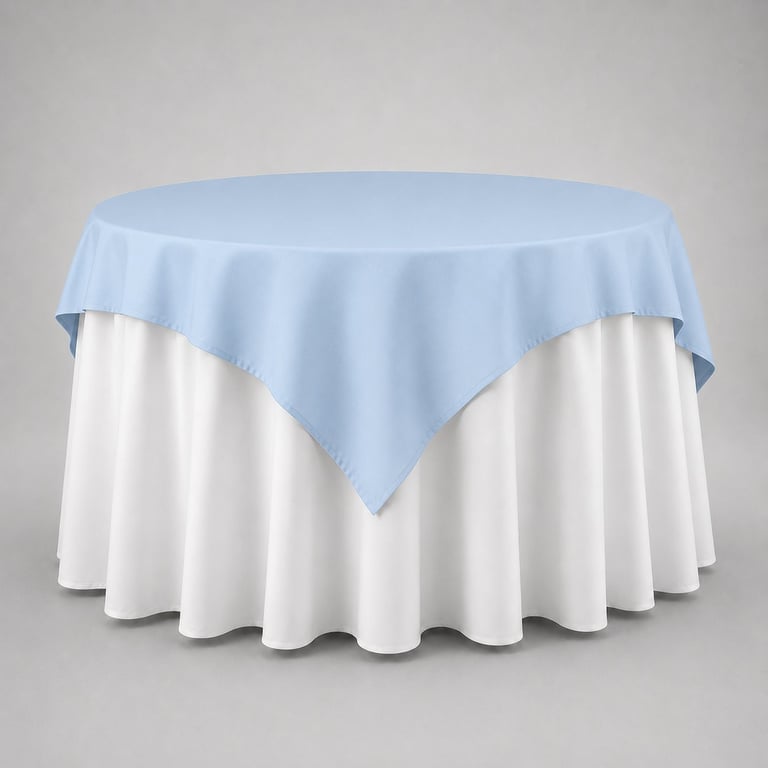 Round table with white floor-length tablecloth and light blue overlay cloth