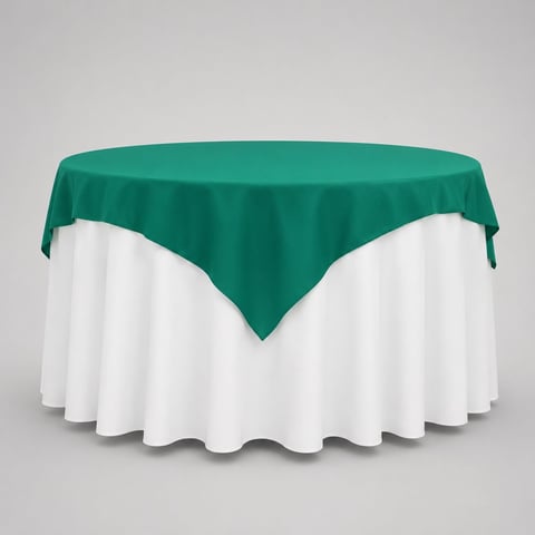 Round table draped with white tablecloth and teal green overlay cloth