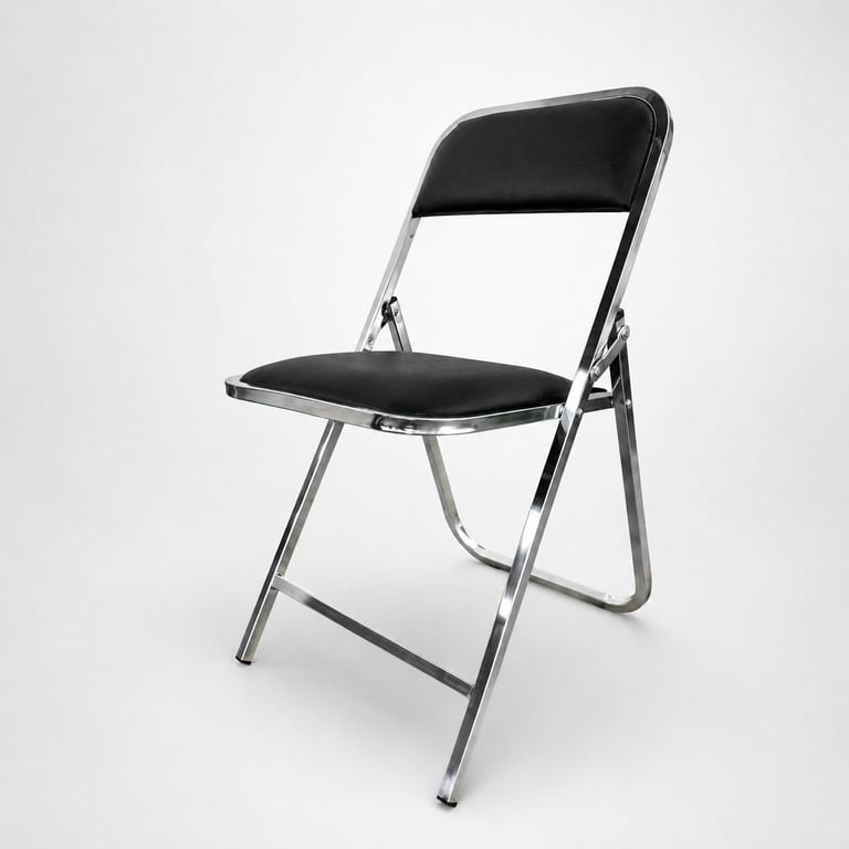 Black and silver folding chair with padded seat and backrest against white background